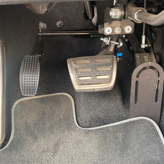 Accelerator pedal moved to the left of the brake